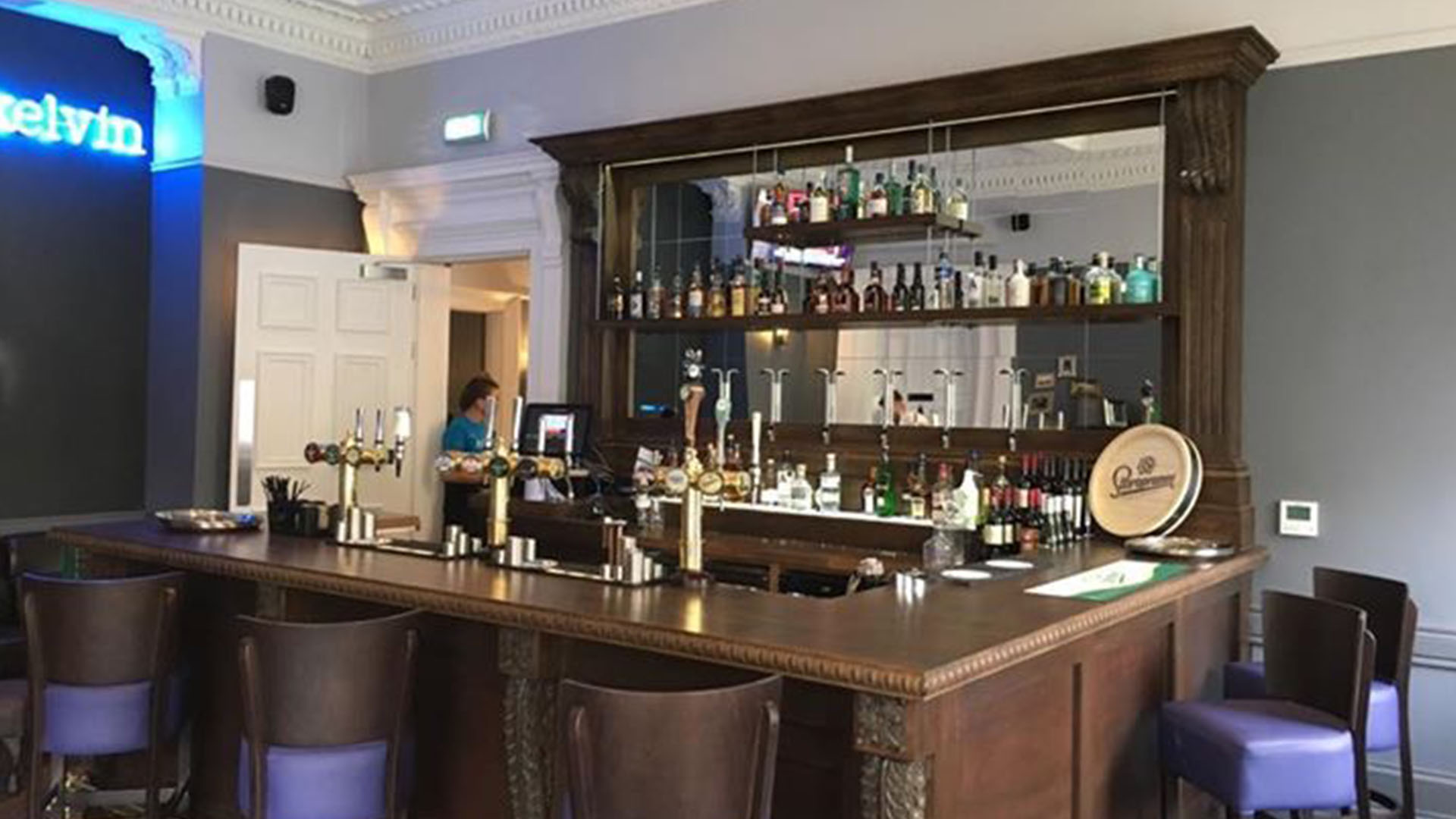Panoramic view of The Lorne Hotel's restored dining room with period ceiling and modern furnishings
