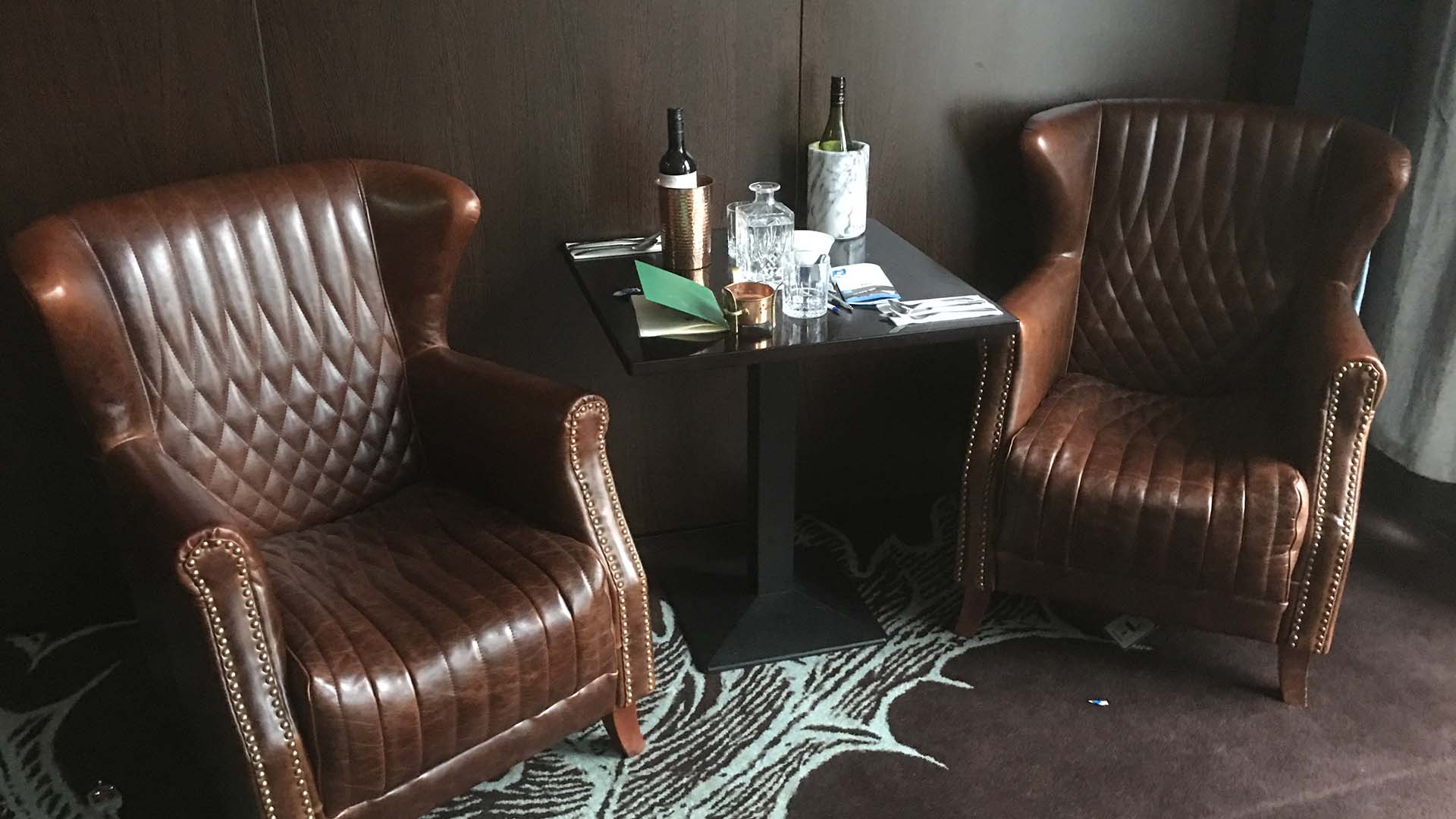 Elevated bar area with bespoke copper fixtures and heritage tile work