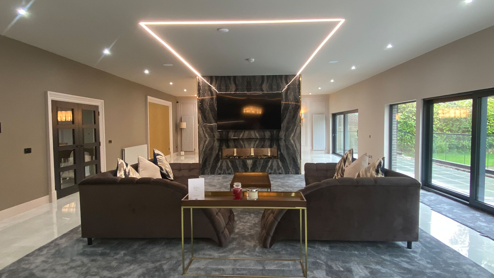 Private Residence, South Lanarkshire — living room with glazed doors to garden