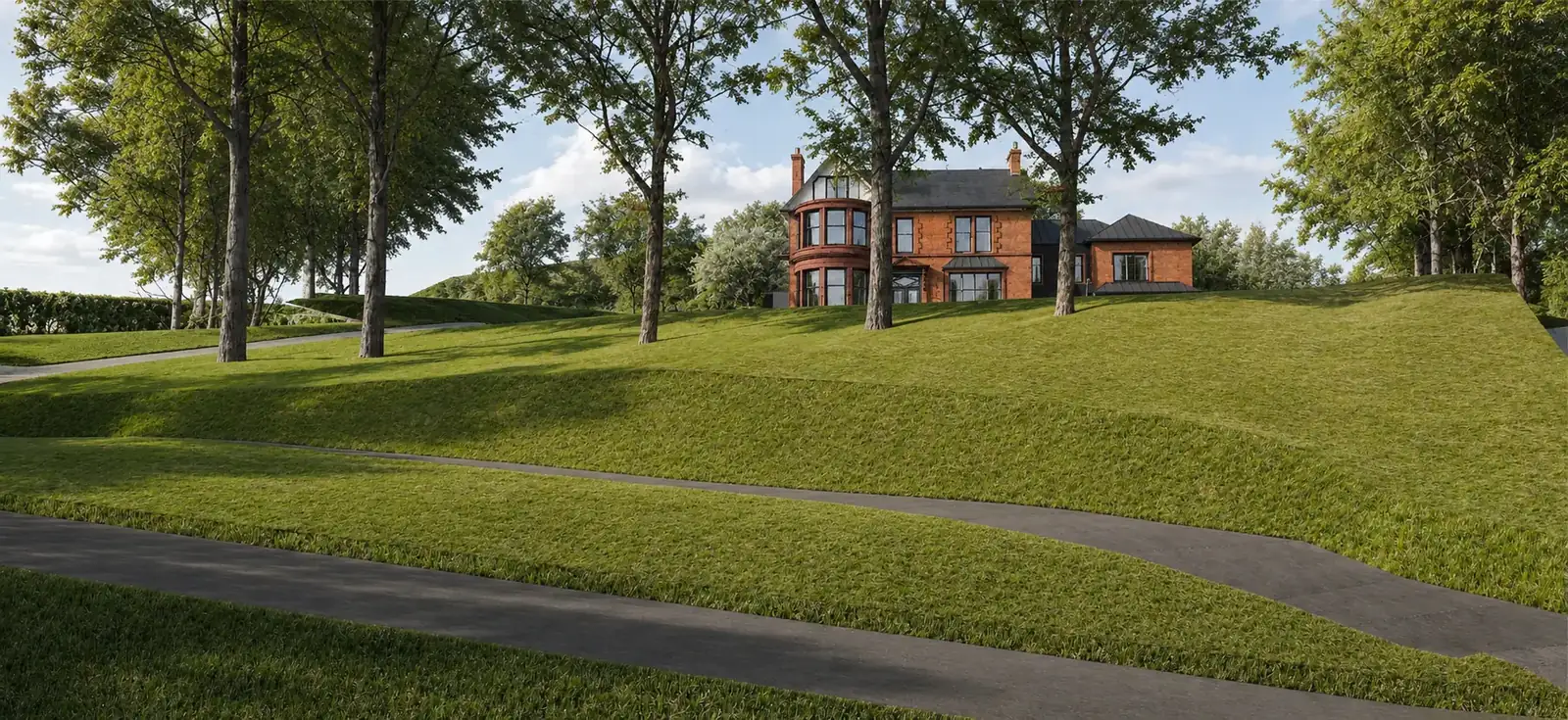 Long view across sloping lawns and mature trees towards the villa on its rise, the extension largely hidden by the landform