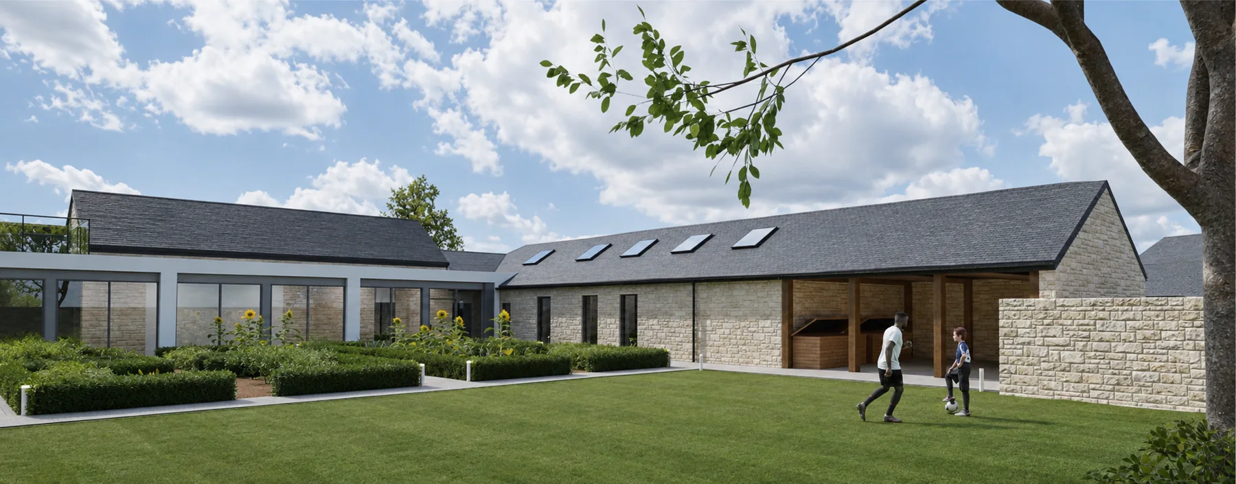 Courtyard garden with the covered workshop range and rooflights, the terrace of the main house to the left