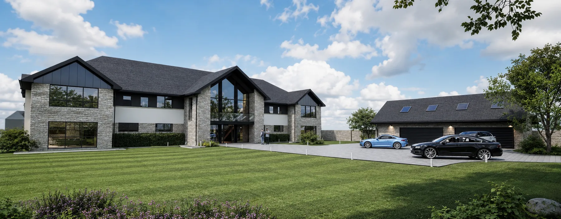Front view across the lawn to the stone and render residence with the detached garage building to the right