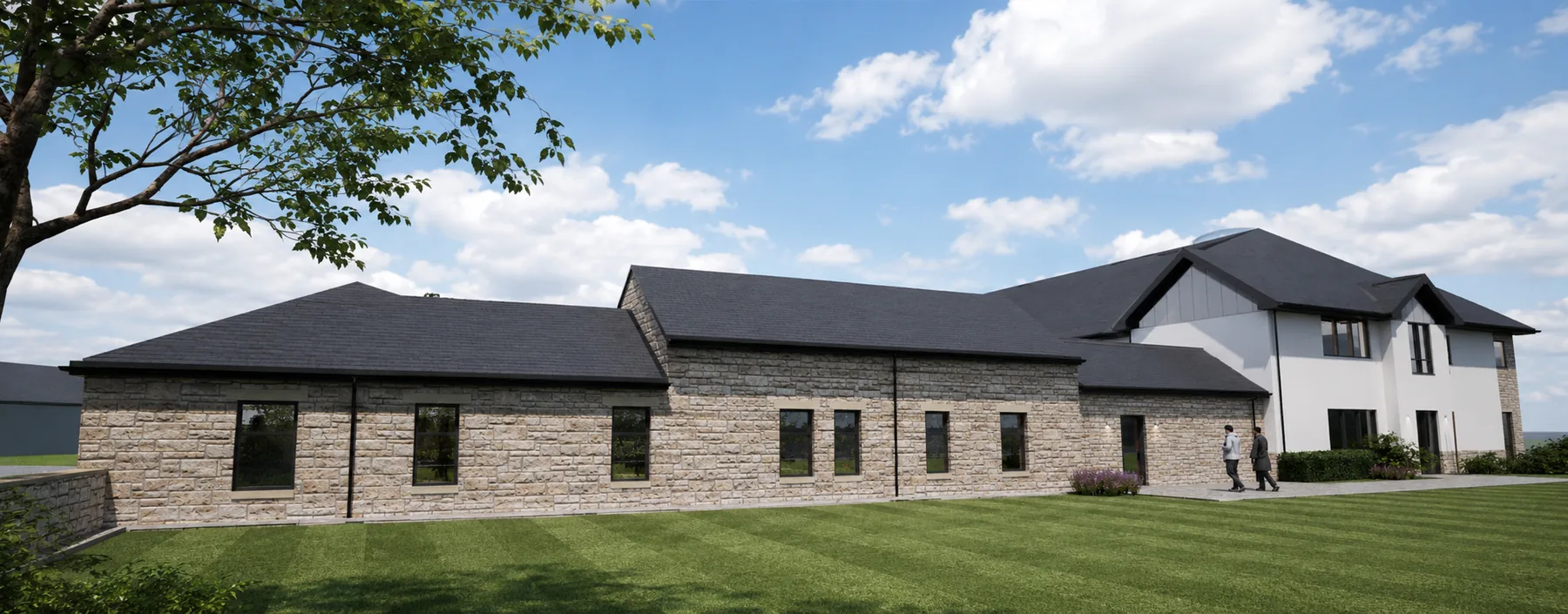 The retained and re-roofed steading range in stone, with the new residence rising behind